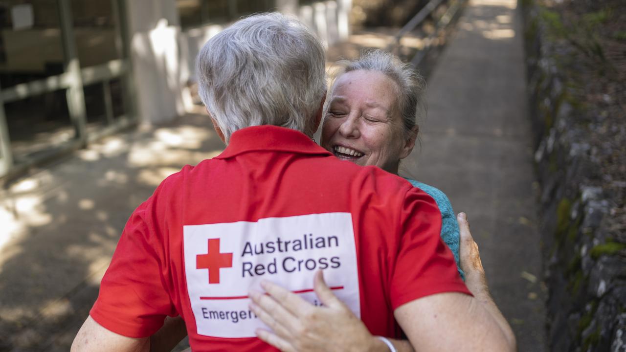 Resident Vicky Harvey greets Australian Red Cross volunteer Jenny Dowell at the Recovery Centre in Lismore in the immediate aftermath of Tropical Cyclone Alfred. Picture: Supplied