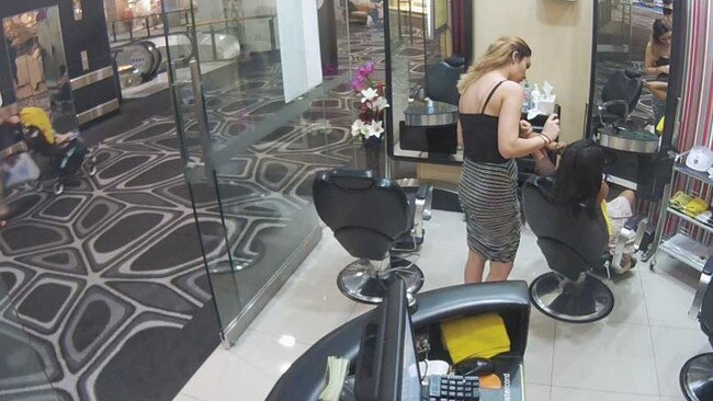 Two women inside a beauty parlour in Queensland are completely unaware they are being watched. 