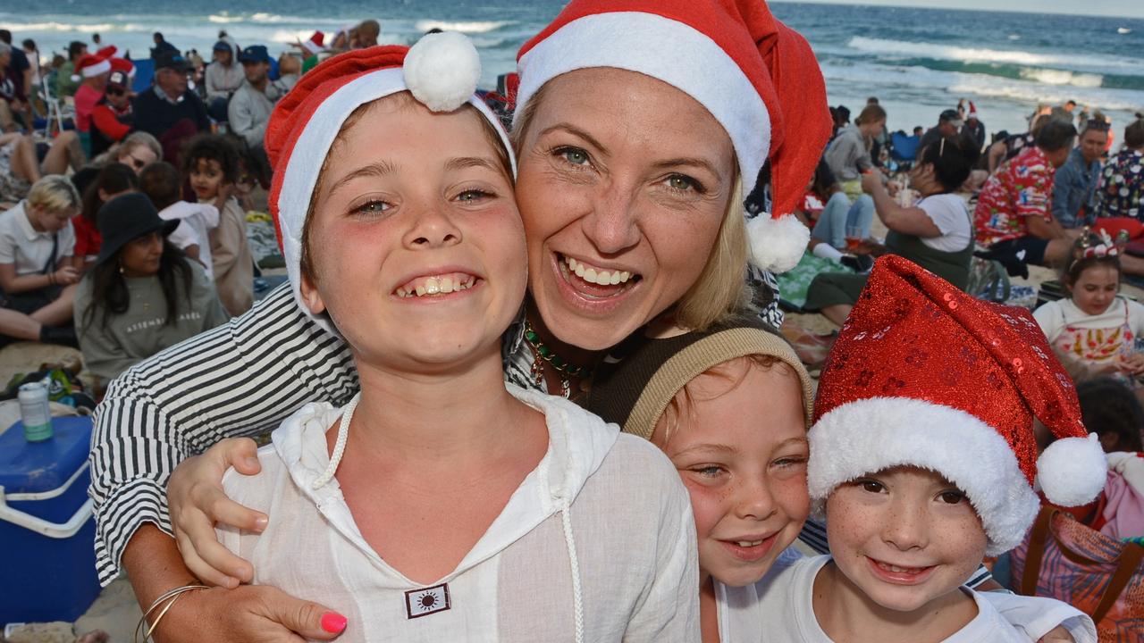 Hudson, Michelle and Lennox Massey with Mack Boe at Carols on the Beach, Surfers Paradise. Pic: Regina King