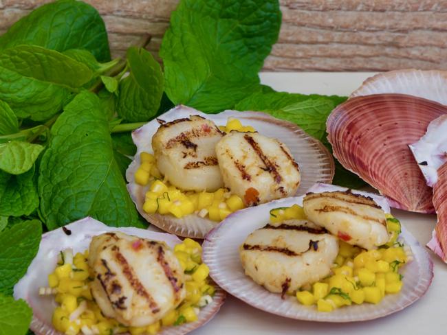 Sydney Seafood School’s red curry scallops with mango and mint salsa. Picture: Franz Scheurer