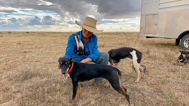 Emily Landsberg with her working dogs in Queensland. Picture: Tricia Agar