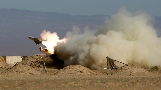 In this picture released by the semi-official Iranian Fars News Agency, Iran's armed forces fires a missile during its air defense war game in the Isfahan province south of the capital Tehran, Iran, Wednesday, Nov. 25, 2009. Iran on Sunday began large-scale air defense war games aimed at protecting its nuclear facilities from attack, state TV reported, as an air force commander boasted the country could deter any military strike by Israel. (AP Photo/Fars News Agency, Amir Hosseini) **  THE ASSOCIATED PRESS HAS NO WAY OF INDEPENDENTLY VERIFYING THE CONTENT, LOCATION OR DATE OF THIS IMAGE **