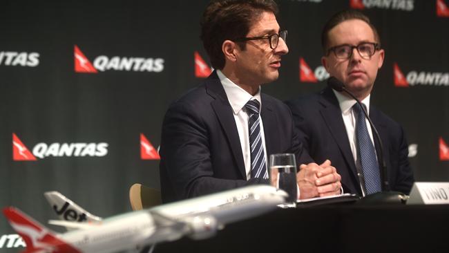 Qantas chief financial officer Tino La Spina (left) and Qantas chief executive officer Alan Joyce (right) announce the group’s results. Picture: AFP/ Peter Parks.