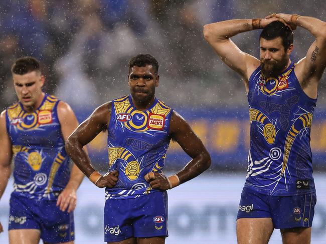 PERTH, AUSTRALIA - JULY 12: Elliot Yeo, Liam Ryan and Josh J. Kennedy of the Eagles look on after being defeated during the round 17 AFL match between the West Coast Eagles and North Melbourne Kangaroos at Optus Stadium on July 12, 2021 in Perth, Australia. (Photo by Paul Kane/Getty Images)