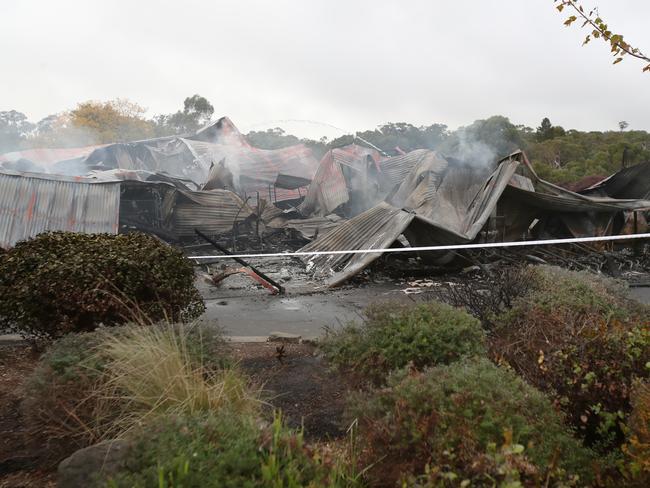 The clubhouse is flattened by the blaze. Picture: David Crosling