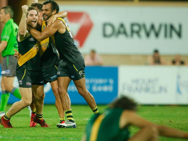 Nightcliff players celebrate their 2019-20 NTFL Grand Final triumph over St Mary’s. But will the short-term future of the Territory game be a bleak one? That is because the COVID-19 crisis is bringing sport all around the world to its knees. Picture GLENN CAMPBELL