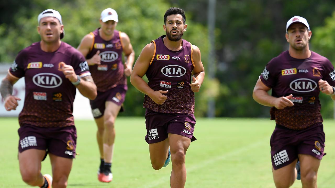 Jordan Kahu and Corey Oates trail behind Darius Boyd and Andrew McCullough at training. Picture: AAP Image/Albert Perez