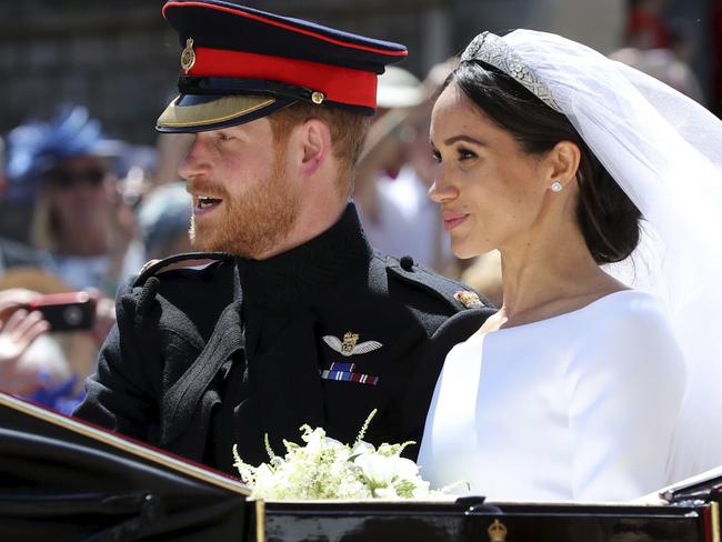 Prince Harry and Meghan Markle leave their wedding ceremony on Saturday.