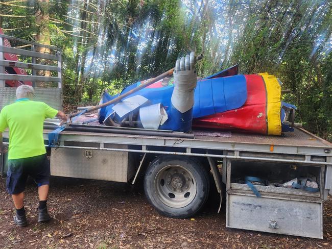 The Big Knight from the old Macadamia Castle near Ballina is strapped to a truck for the journey to the Coffs Harbour Butterfly House.