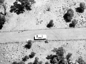 Photographs retrieved from a crashed helicopter as police raced to solve a triple murder in Queensland's Outback.