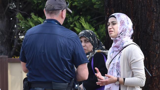 Police talk to residents in Meadow Heights. Picture: Jay Town