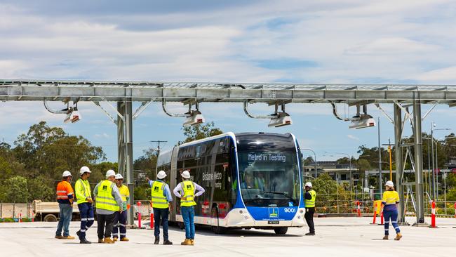 A Metro bus being charged.