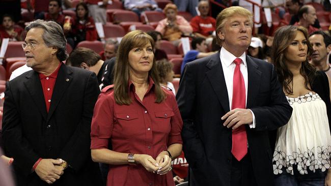 Miami Heat team owner Micky Arison and his wife Madeleine join Donald Trump and wife Melania at the Miami Heat versus Los Angeles Lakers game on December 25, 2005. Picture: Getty