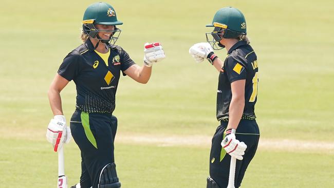 Ashleigh Gardner and Meg Lanning share a moment while batting for Australia. Picture: AAP