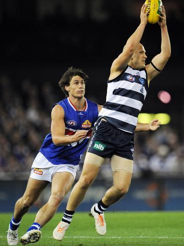 Geelong v Western Bulldogs. Etihad Stadium. Gary Ablett Jr gets tackled by Ryan Griffen. Picture: Colleen Petch