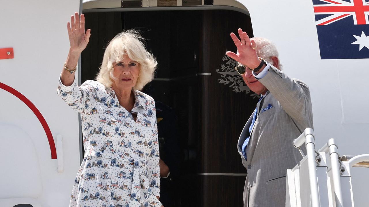 Britain's King Charles III and Queen Camilla wave as they depart from Sydney Airport in Sydney on October 23, 2024, after a six-day royal visit to Sydney and Canberra. (Photo by David GRAY / AFP)