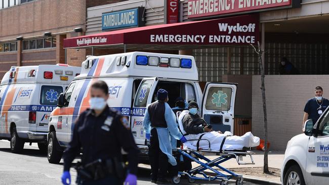 Medical staff move a patient into the Wyckoff Heights Medical Center emergency room in Brooklyn. Picture: Angela Weiss / AFP.