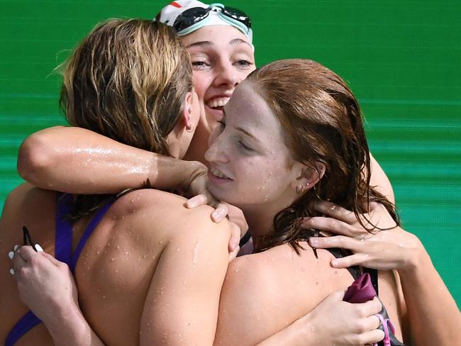 ADELAIDE, AUSTRALIA - JUNE 14: Ariarne Titmus,Meg Harris and Mollie O'Callaghan hug after all qualifying after the Women's 200 Metre Freestyle final  during the Australian National Olympic Swimming Trials at SA Aquatic & Leisure Centre on June 14, 2021 in Adelaide, Australia. (Photo by Mark Brake/Getty Images)