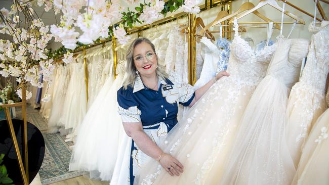 Forever You Bridal owner, Liz Wall among dresses at her shop at Mawson Lakes. Picture Mark Brake