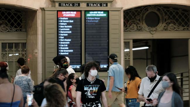 People wear masks while walking in Grand Central Terminal in New York City. Picture: Getty Images