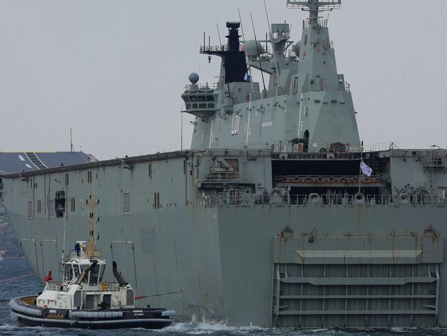 SYDNEY, AUSTRALIA - January 04: HMAS Adelaide loads supplies and departs Sydney, Garden Island in Sydney on January 04, 2020. Sunday Telegraph/ Gaye Gerard