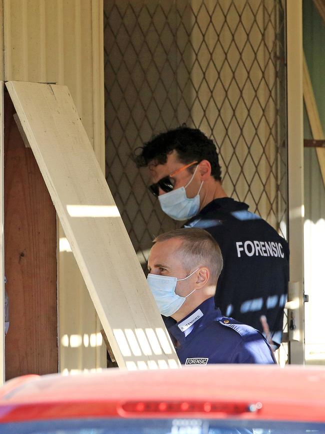 Police detectives outside the Tootgarook home. Picture: Mark Stewart