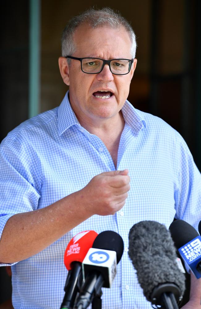 Prime Minister Scott Morrison backs Mr Christensen at a press conference on Sunday. Picture: AAP