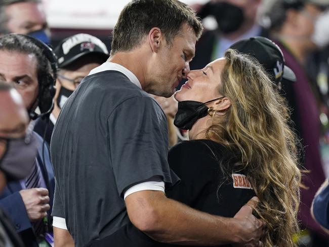 Tampa Bay Buccaneers quarterback Tom Brady kisses wife Gisele Bundchen after defeating the Kansas City Chiefs in the NFL Super Bowl 55 football game Sunday, Feb. 7, 2021, in Tampa, Fla. The Buccaneers defeated the Chiefs 31-9 to win the Super Bowl. (AP Photo/Mark Humphrey)