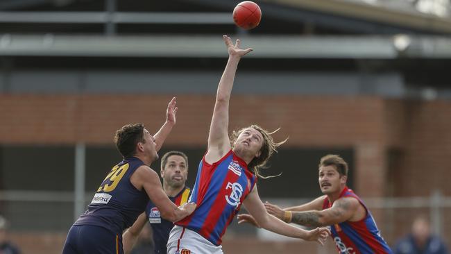 Tommy Cooper wins a hitout for Springvale Districts.