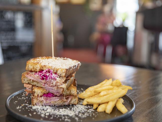 Lansdowne cafe’s towering Reuben sandwich which features thick slices of sourdough and thick-cut pastrami. Picture: Linda Higginson