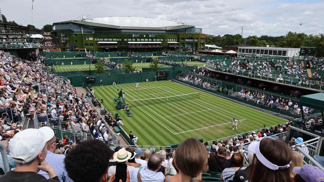 Wimbledon is go – except for the rain. Photo by Adrian DENNIS / AFP