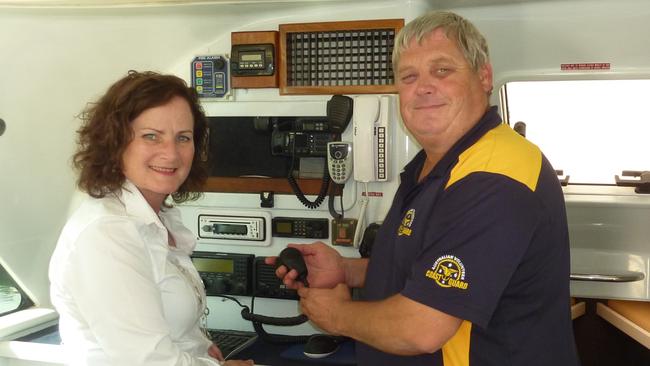 Manly Coast Guard Commander Steve Fleming shows Joan Pease some of the communications gear aboard CG-29.