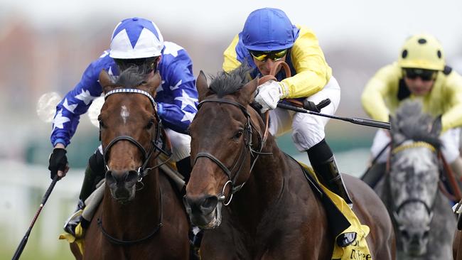 Marmelo (yellow/blue cap) wins at Newbury, England, in April. Picture: Getty Images