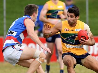 13/08/16 - SANFL: Central District v Eagles at Elizabeth Oval. Eagles Jared Petrenko fends of Centrals Christopher Jansen. Photo Tom Huntley