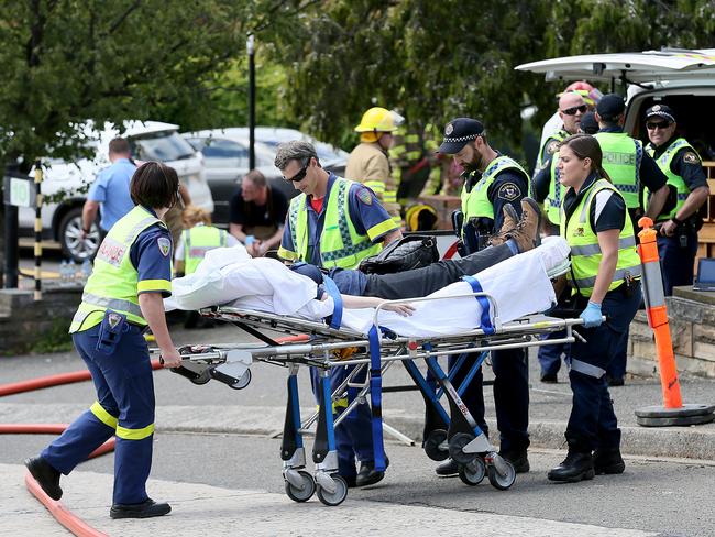 A Peacock Centre staff member is taken to hospital suffering from smoke inhalation. Picture: SAM ROSEWARNE.