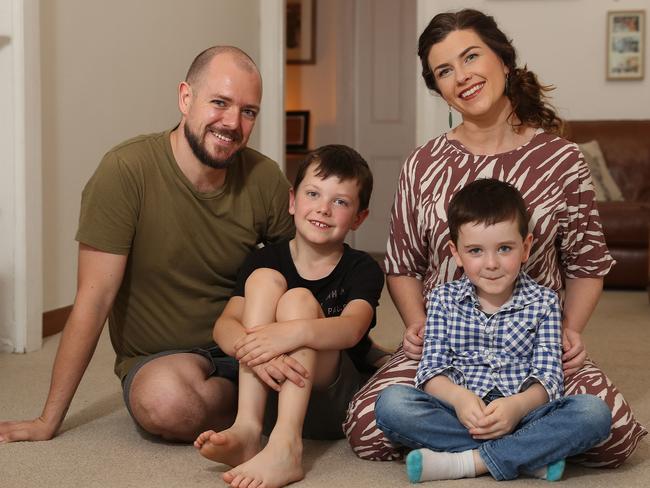 Mark and Jennifer Higgins with their children Ruairi and Oliver. Picture: Brett Costello