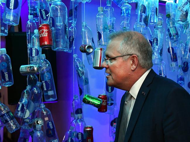 Australia's Prime Minister Scott Morrison walks past a plastic bottle installation at a clean oceans event at the United Nations in New York, United States, Tuesday, September 24, 2019. (AAP Image/Mick Tsikas) NO ARCHIVING