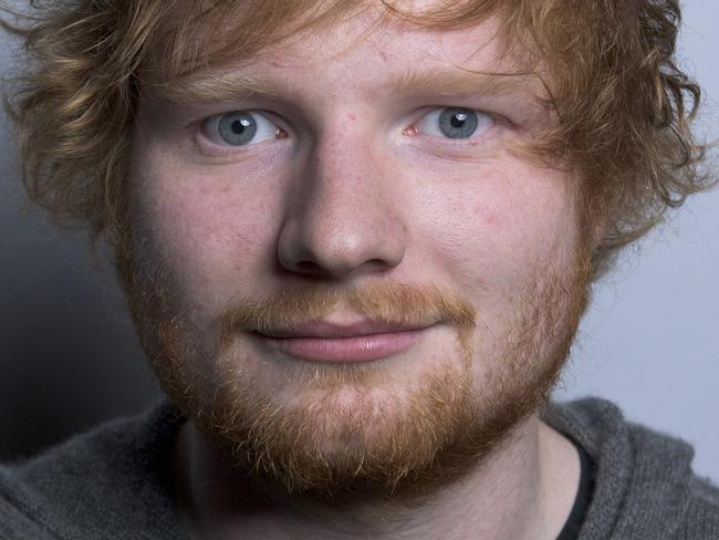 In this Friday, Oct. 16, 2015 photo, Ed Sheeran poses for a portrait in promotion of his full-length concert feature, "Ed Sheeran: Jumpers for Goalposts," in New York. The movie premieres in London this week. (Photo by Drew Gurian/Invision/AP)