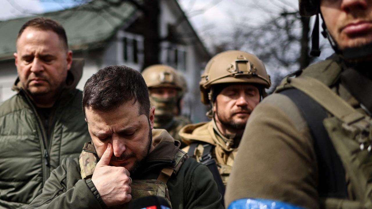 President Volodymyr Zelensky wipes a tear as he walks in the town of Bucha, about 25km northwest of capital Kyiv. Picture: Ronaldo Schemidt/AFP