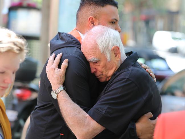 Business partner Nino Pangrazio is comforted by family. Picture: Alex Coppel