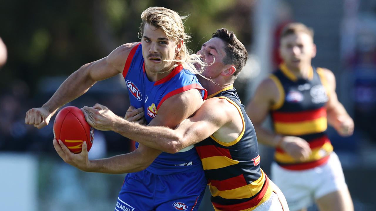 Jones tackling Bailey Smith. Photo by Michael Klein