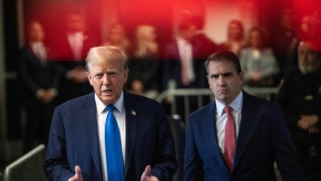 Former US president and Republican presidential candidate Donald Trump, flanked by lawyer Todd Blanche (R) arrives at Manhattan Criminal Court. (Photo by Victor J. Blue / POOL / AFP)