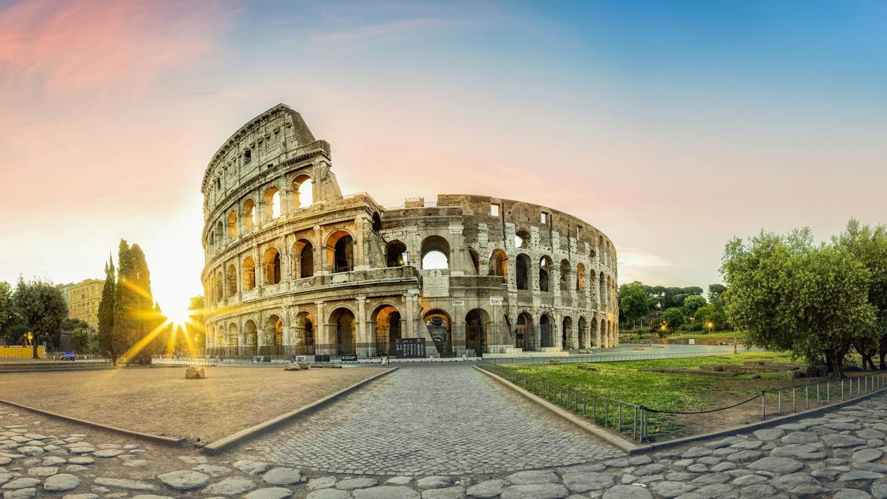 the Colosseum in Rome and morning sun, Italy