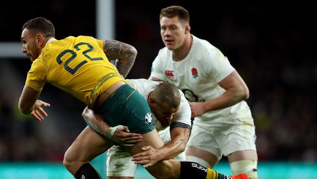 Quade Cooper is crunched by Jonathan Joseph during the Old Mutual Wealth Series last year.
