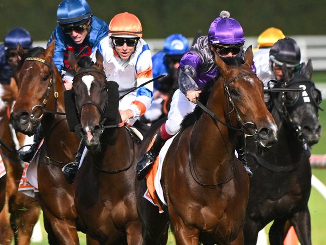 MELBOURNE, AUSTRALIA - OCTOBER 14: Ben Melham riding Griff defeats Damian Lane riding Veight and Steparty in winning Race 9, the Neds Caulfield Guineas, during Melbourne Racing at Caulfield Racecourse on October 14, 2023 in Melbourne, Australia. (Photo by Vince Caligiuri/Getty Images)