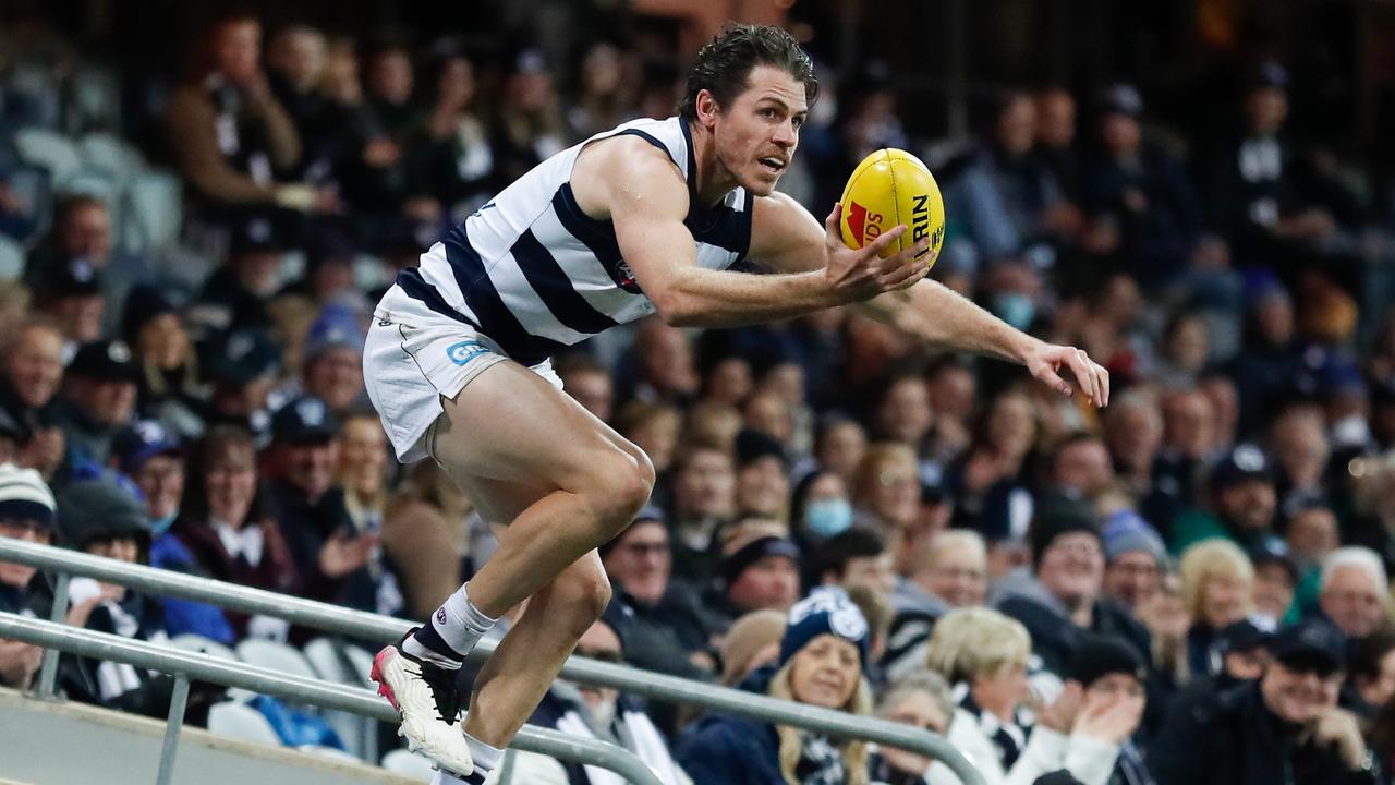 Isaac Smith retrieves the ball from an empty section of the grandstand.