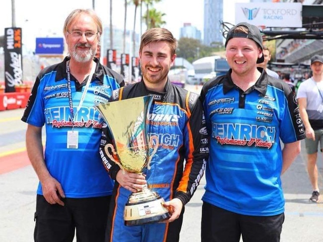 Joel Heinrich with his 2018 Aussie Racing Car Series winner's trophy with his dad, Bruce, and Pit crew Scott Goding. Picture: Supplied.