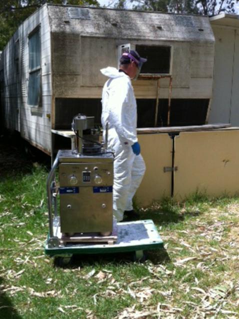 A crime scene officer with the pill press.