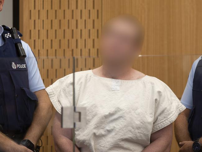 Brenton Harrison Tarrant is lead into the dock for his appearance for murder, in the District Court, Christchurch, New Zealand. Picture: AAP