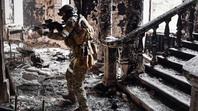 A Russian soldier patrols at the Mariupol drama theatre, hit by an air strike in 2022. British technology is still finding its way to Russia’s military nearly two years after the full-scale invasion of Ukraine began. Picture: AFP